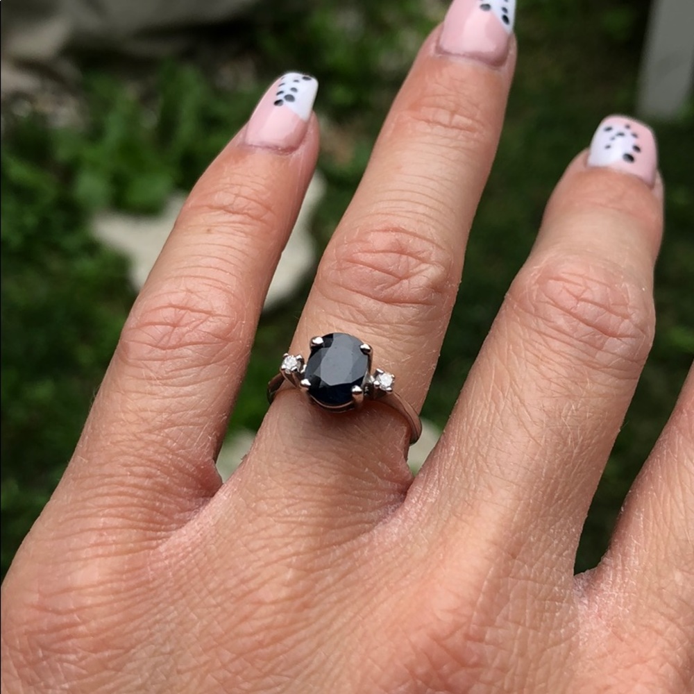 Sapphire ring with two diamonds